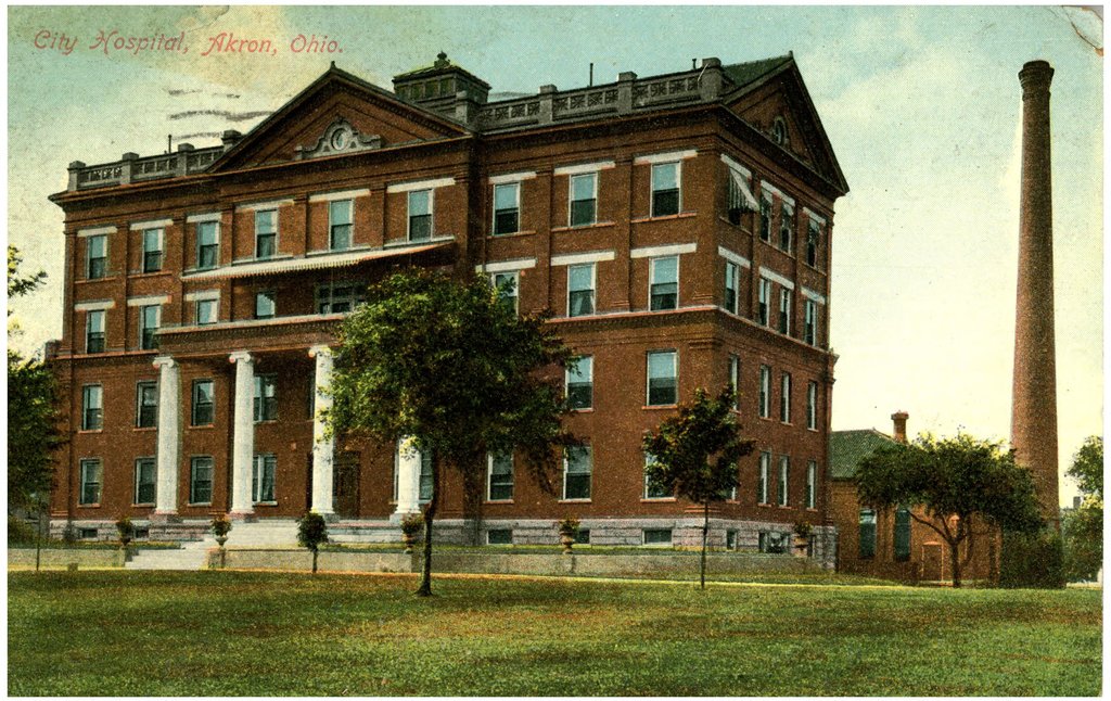 A color postcard of a large brick hospital building with towers, set on a lawn.