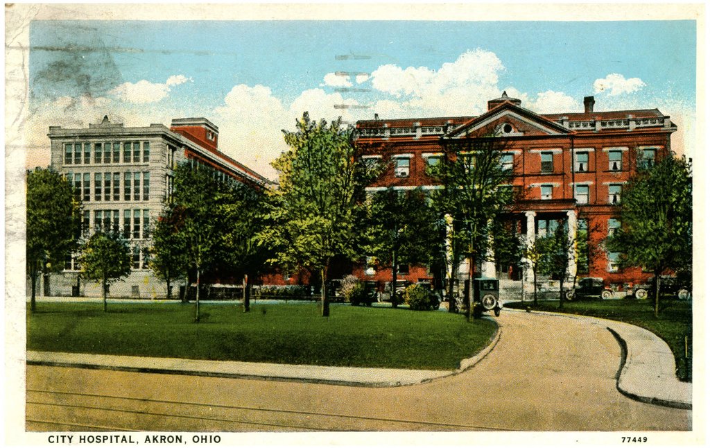 A color postcard of City Hospital in Akron, showing its two large buildings.