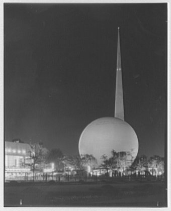 The Trylon and Perisphere at the 1939 New York World’s Fair, lit up at night.